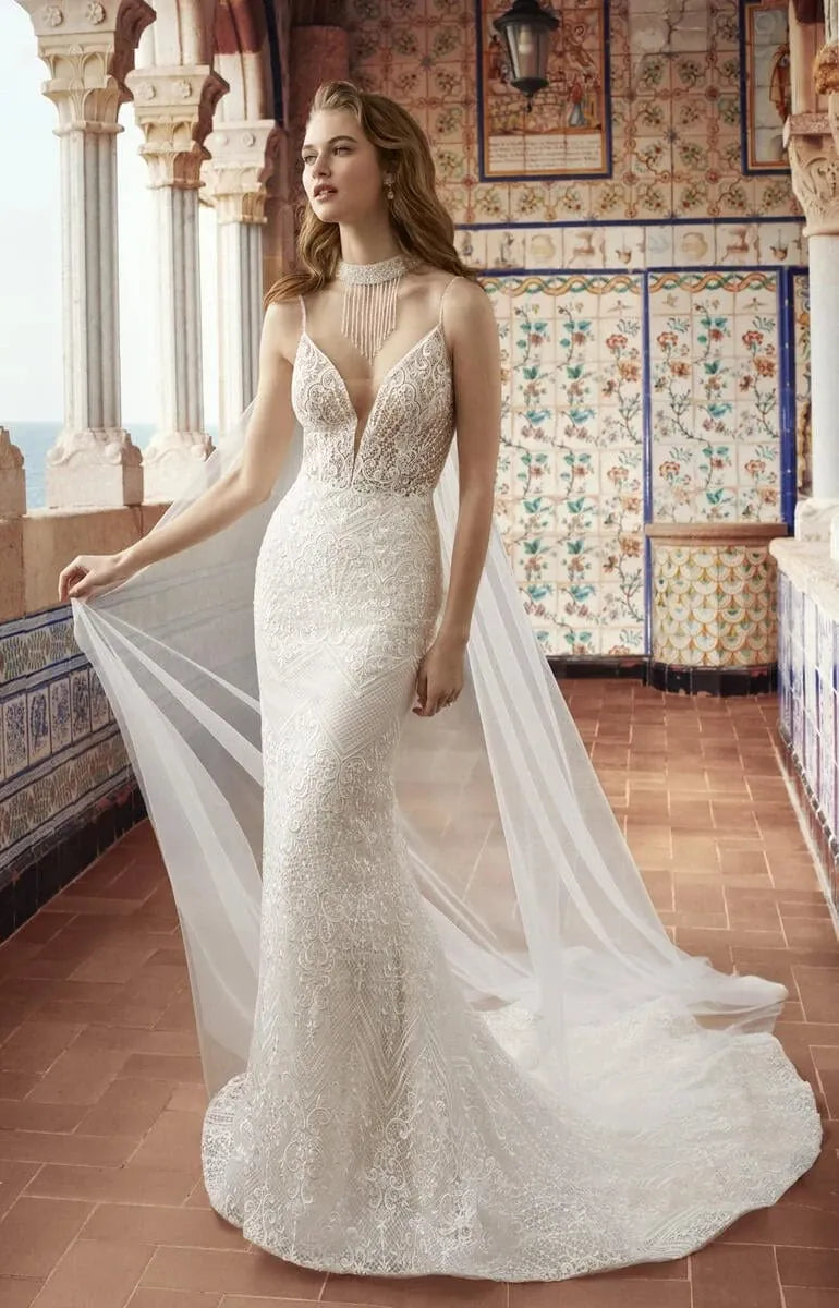 abella lace fit and flare wedding dress showing the front of the gown, with a deep V neckline and spaghetti straps