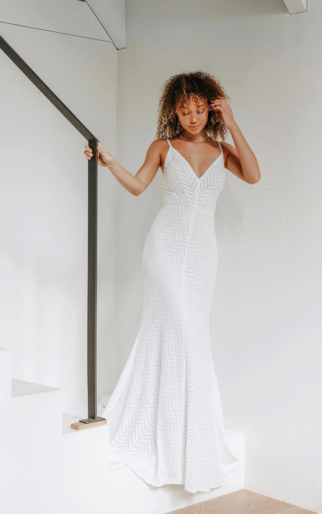 full front of all who wander archer ivory lace fit and flare wedding dress with a geometric pattern and v neckline