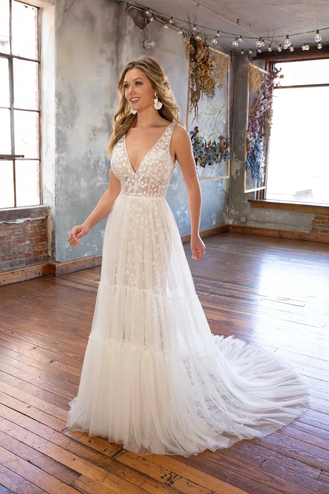 full front of all who wander cece ivory lace fitted wedding dress with the matching tulle overskirt