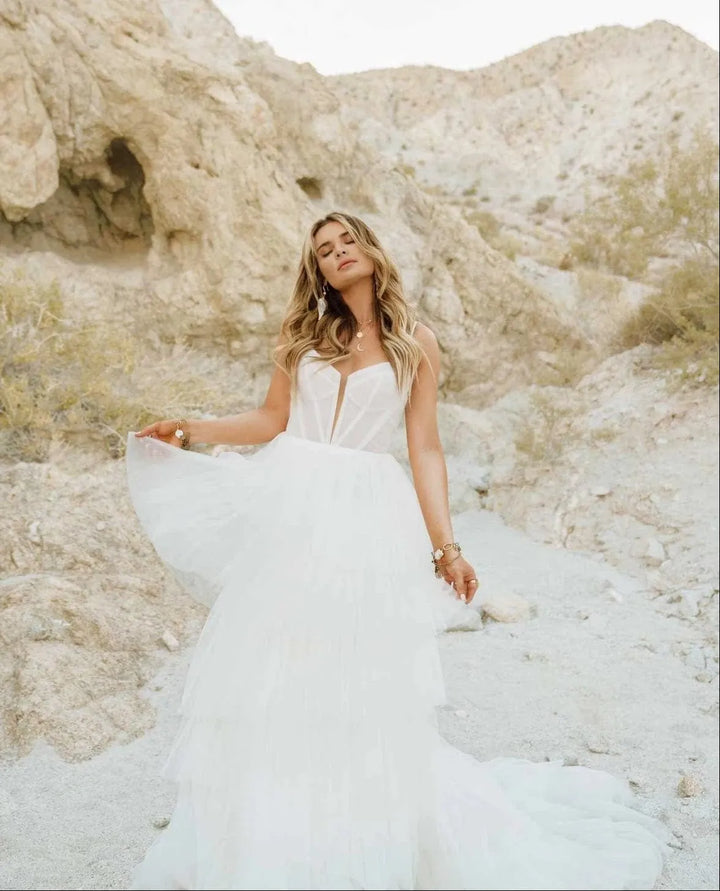 close up of all who wander jasper ivory tulle ball gown wedding dress with tiered skirt and detailed bodice