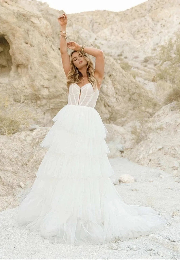 full front of all who wander jasper ivory tulle ball gown wedding dress with tiered skirt and detailed bodice