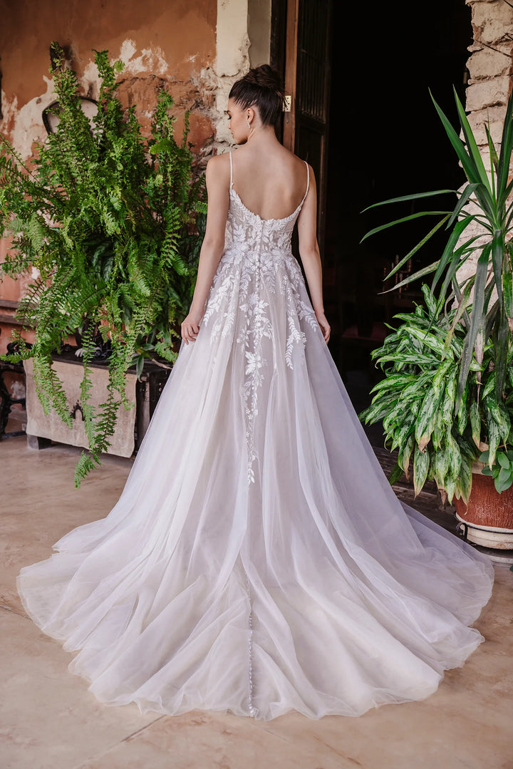 full back of allure 9951 mocha tulle a-line wedding dress featuring an open back, cascading floral lace appliques, and a chapel length train