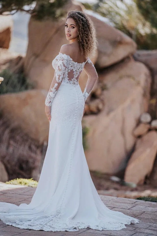 full back of allure a1166 ivory crepe sheath wedding dress with long sleeves and a short train detailed with lace