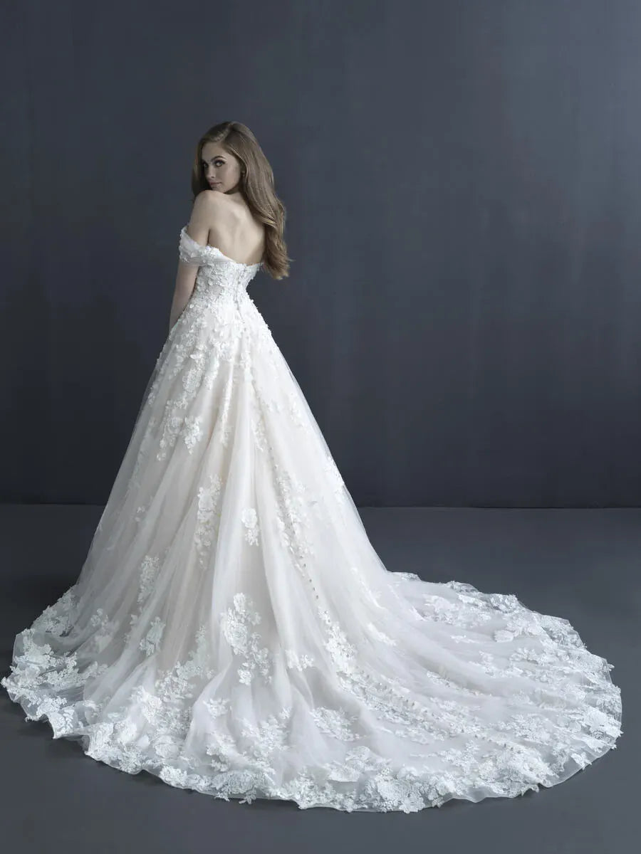 White lace wedding dress on a model against a dark background