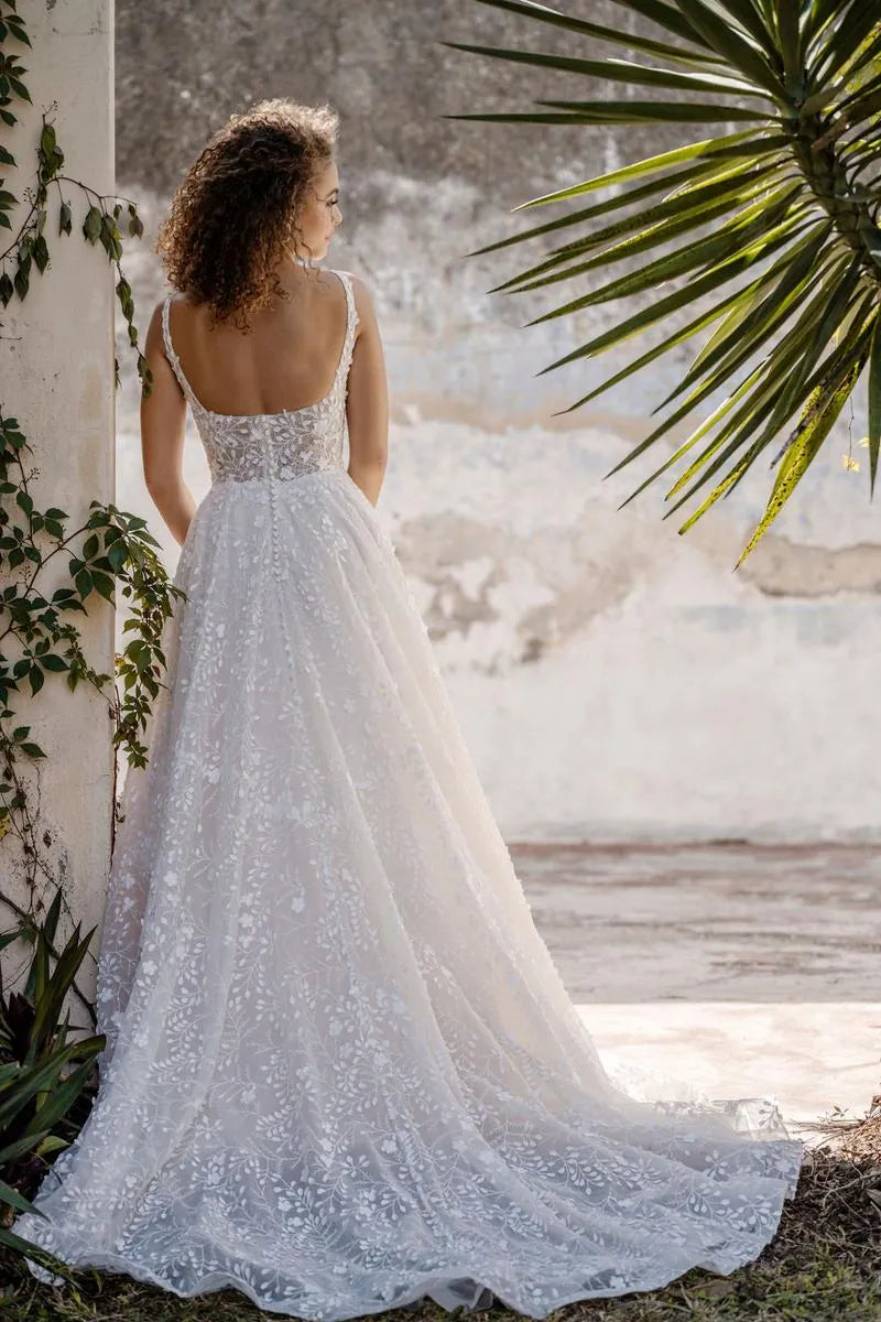 allure c659 tulle a-line wedding dress showing the back of the gown, with square back and chapel-length train
