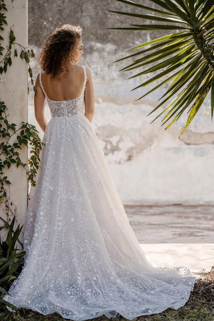 allure c659 tulle a-line wedding dress showing the back of the gown, with square back and chapel-length train