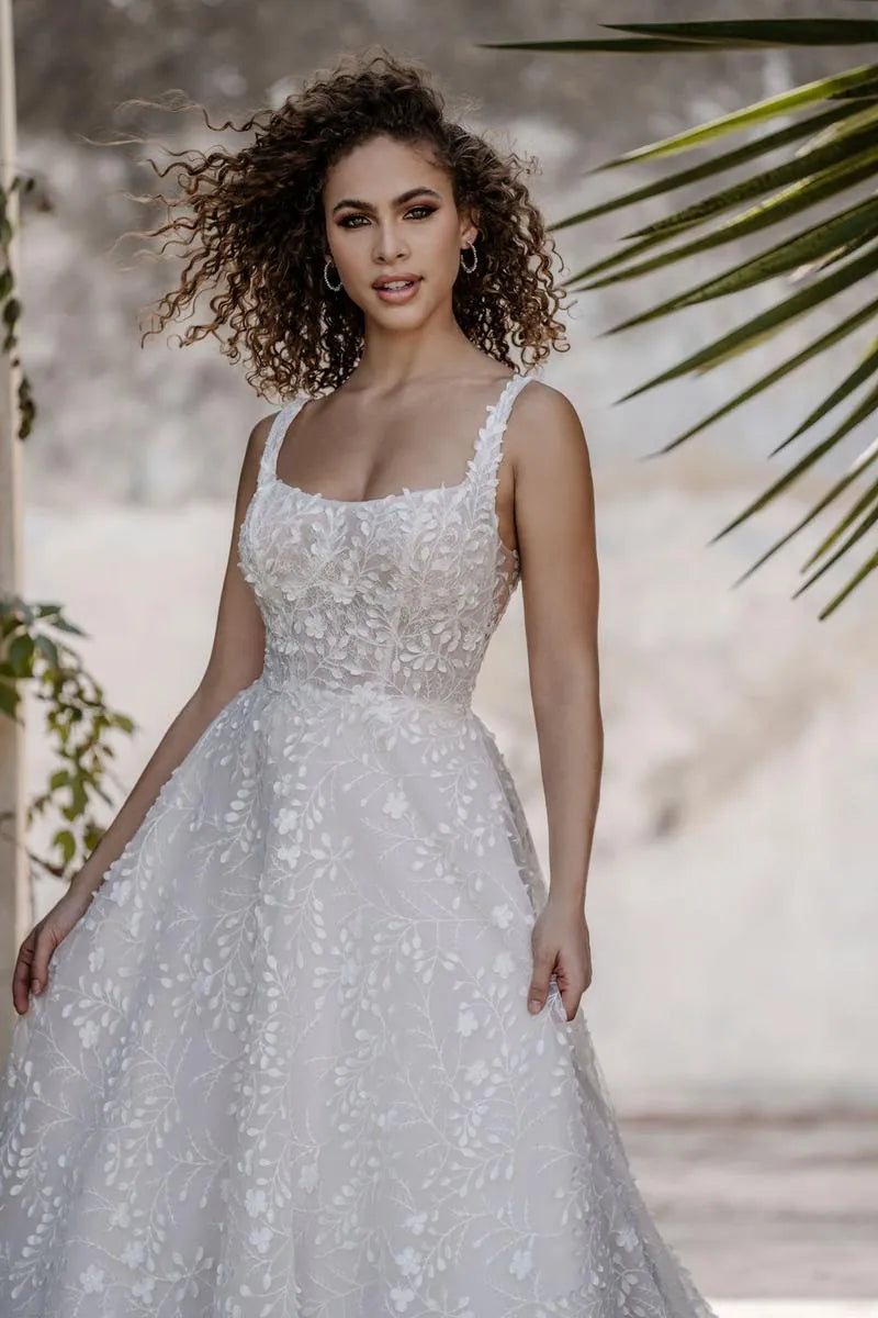 allure c659 tulle a-line wedding dress showing a close up of the front of the gown, with square neckline and floral print