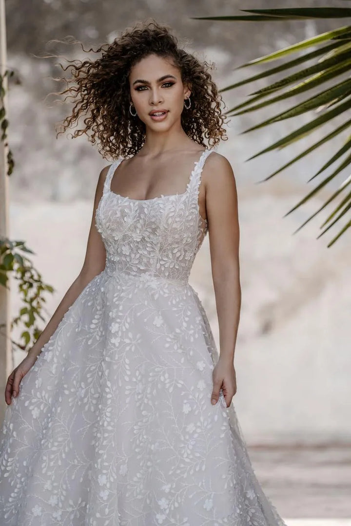 allure c659 tulle a-line wedding dress showing a close up of the front of the gown, with square neckline and floral print
