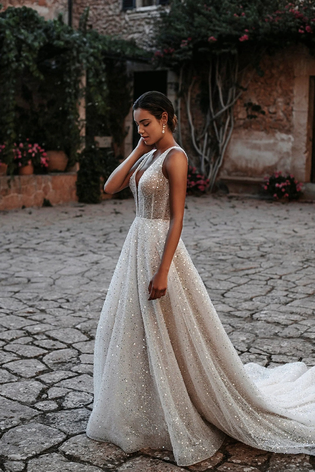 full front of abella e214 ivory a-line wedding dress of allover sequins, with a plunge neckline