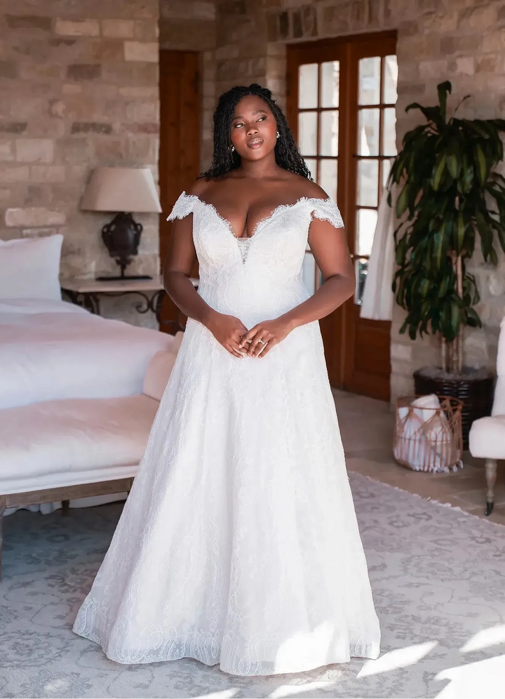 full front of allure w501 nude lace a-line wedding dress featuring an off the shoulder neckline and detailed lace pattern