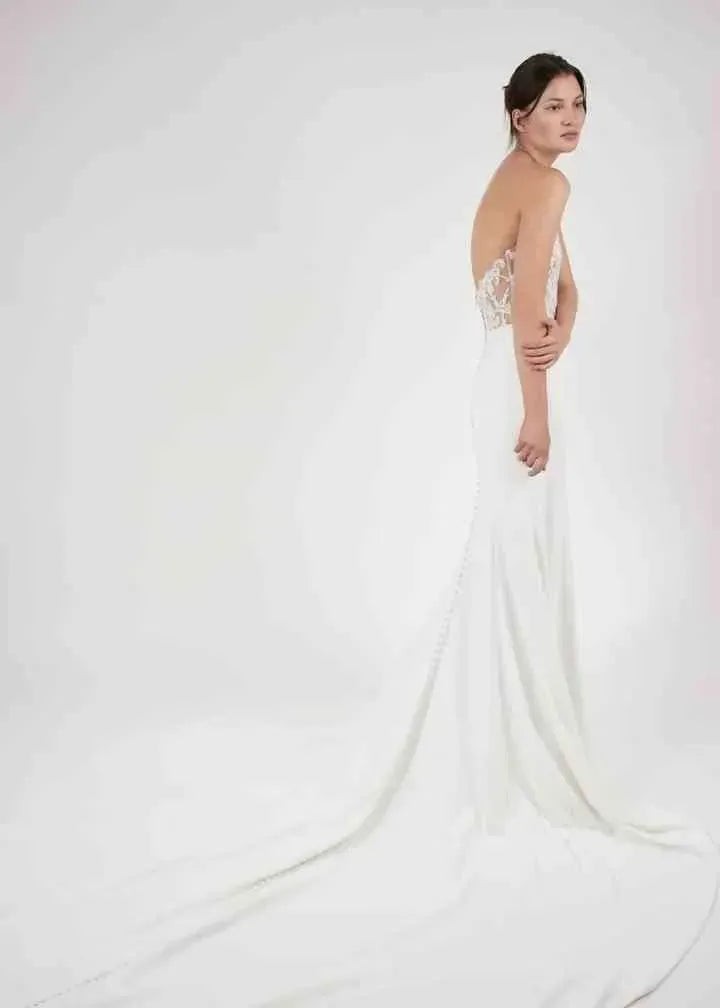 full back of alyne zadye ivory crepe fitted wedding dress with a lace applique bodice