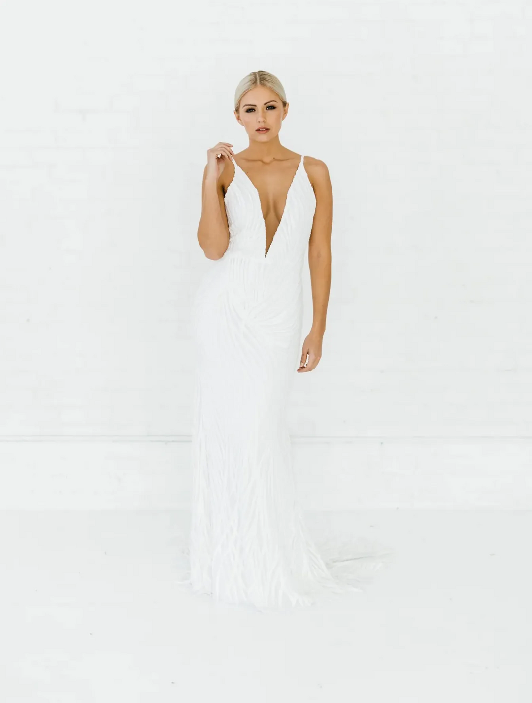 full front of alyssa kristin hadley ivory beaded fitted wedding dress with a plunging neckline