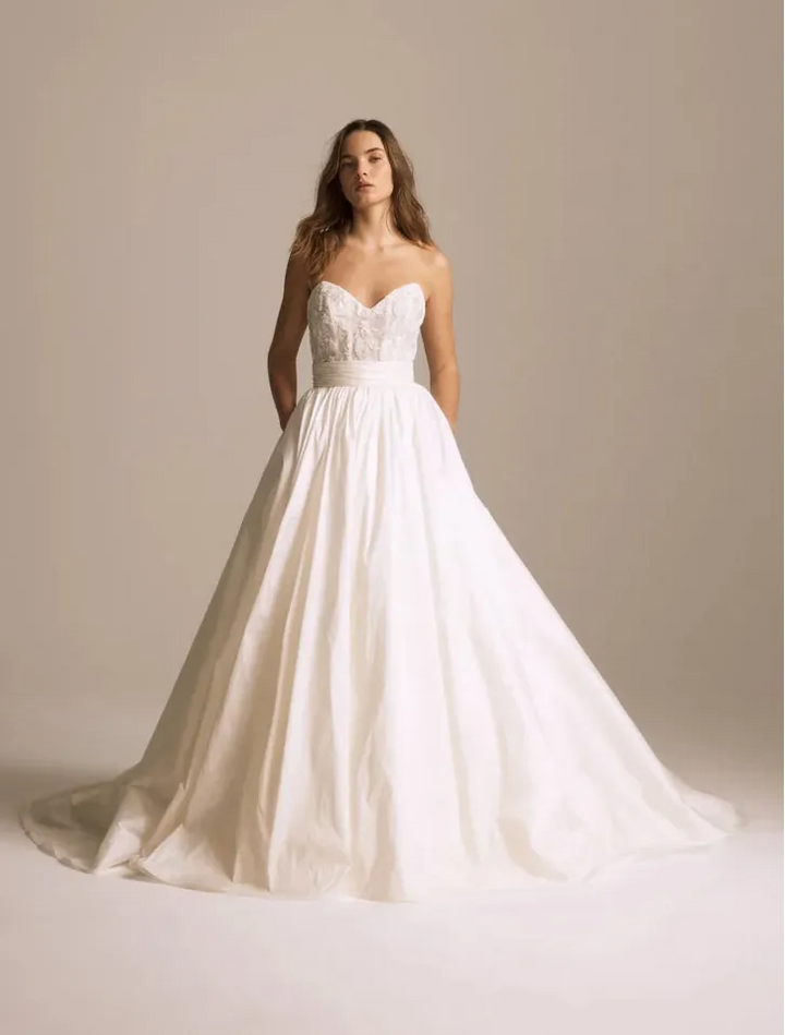 front of amsale pepper ivory taffeta ball gown wedding dress with a beaded bodice and pockets in the skirt