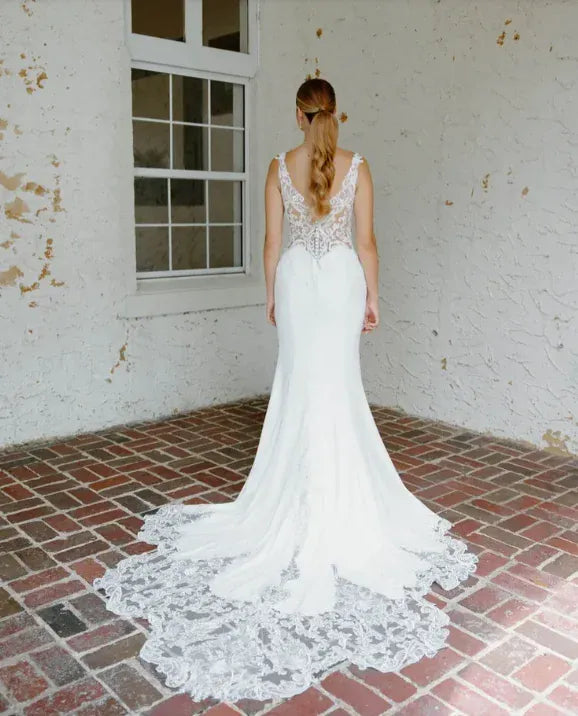 full back of angel rivera hibiscus crepe sheath wedding dress with lace appliques and a shaped lace train