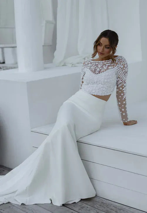 full front of anna campbell lissia ivory lace topper with an illusion neckline and long sleeves