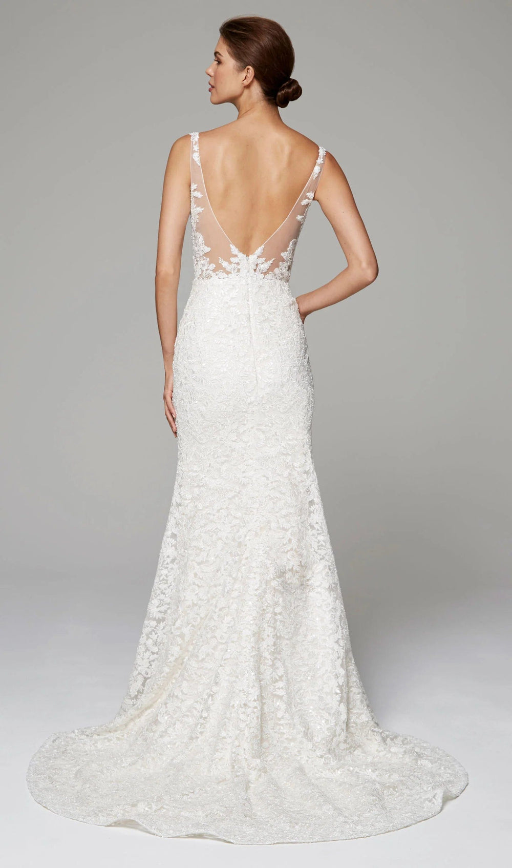 full back of anne barge aubrey ivory lace sheath wedding dress with a v neckline and chapel length train