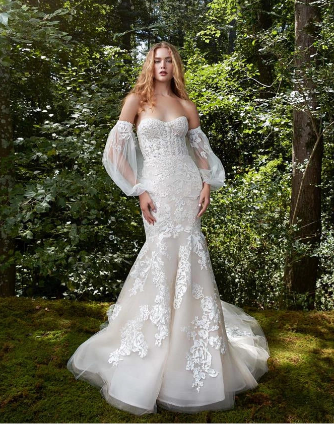 front of anne barge bliss ivory tulle fit and flare wedding dress with lace appliques scattered throughout and detached long sleeves