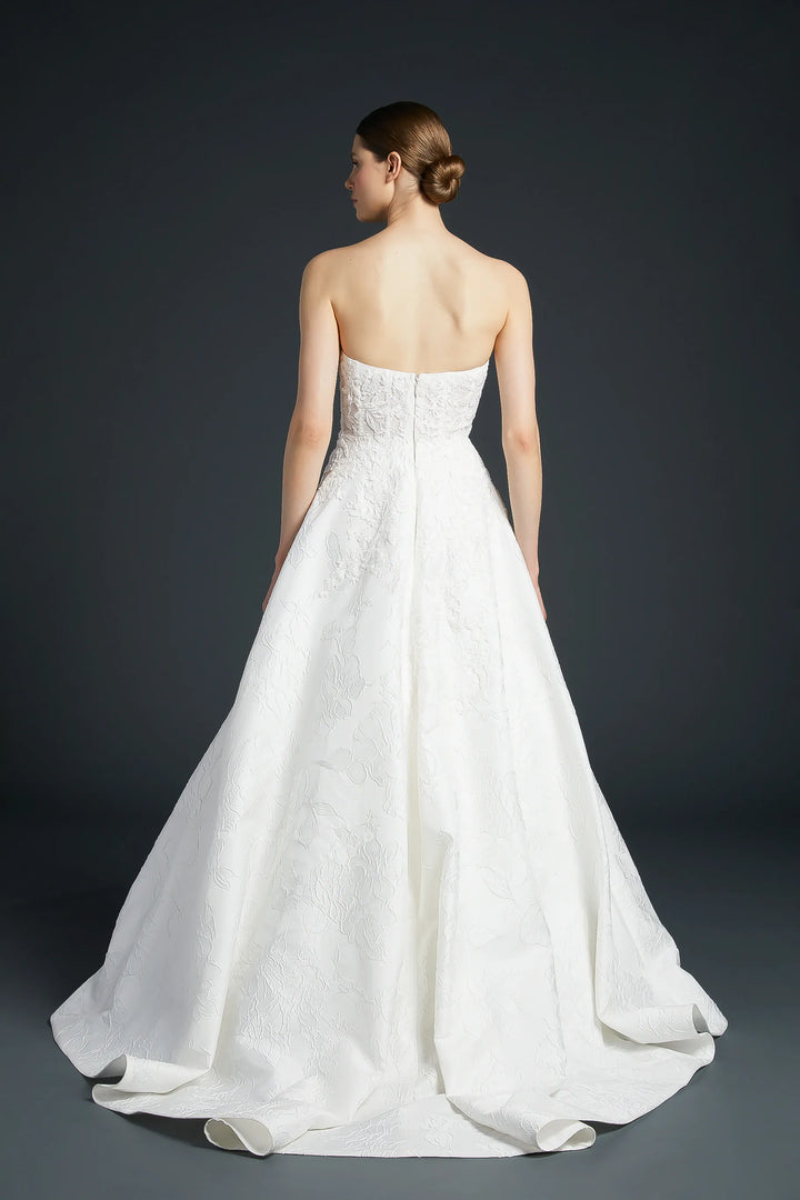 White strapless wedding dress on a dark background