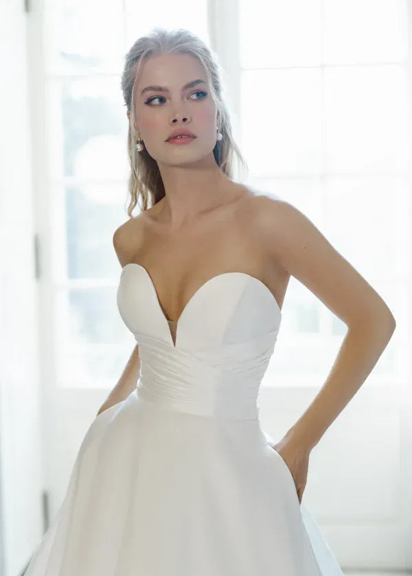 close up of anne barge callanwolde ivory mikado a-line wedding dress with a strapless sweetheart neckline