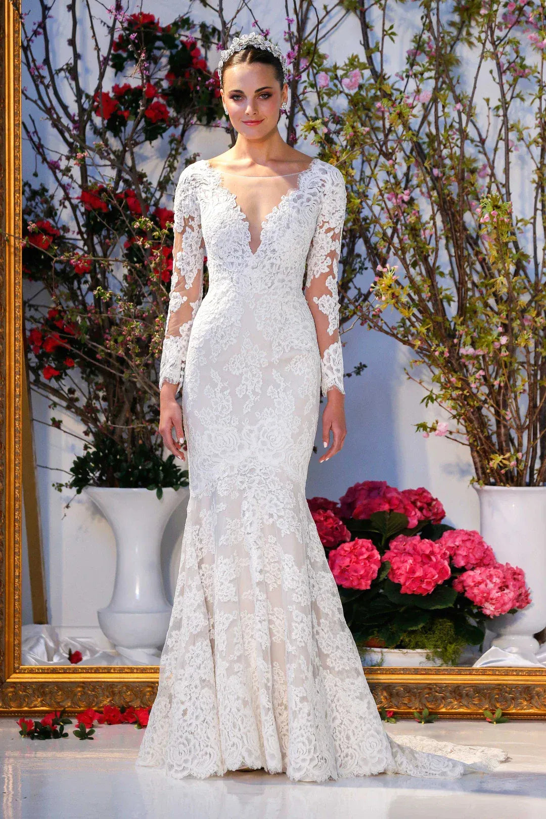 full front of anne barge laurel ivory fitted lace wedding dress with a V neckline and long sleeves
