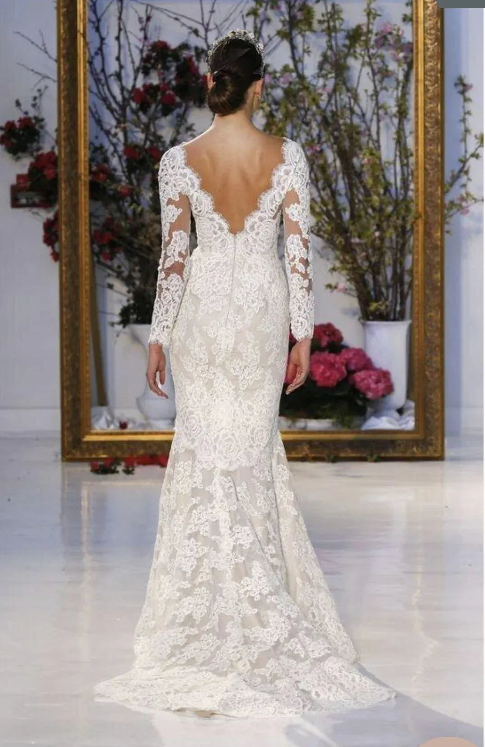 full back of anne barge laurel ivory fitted lace wedding dress with a V neckline and long sleeves
