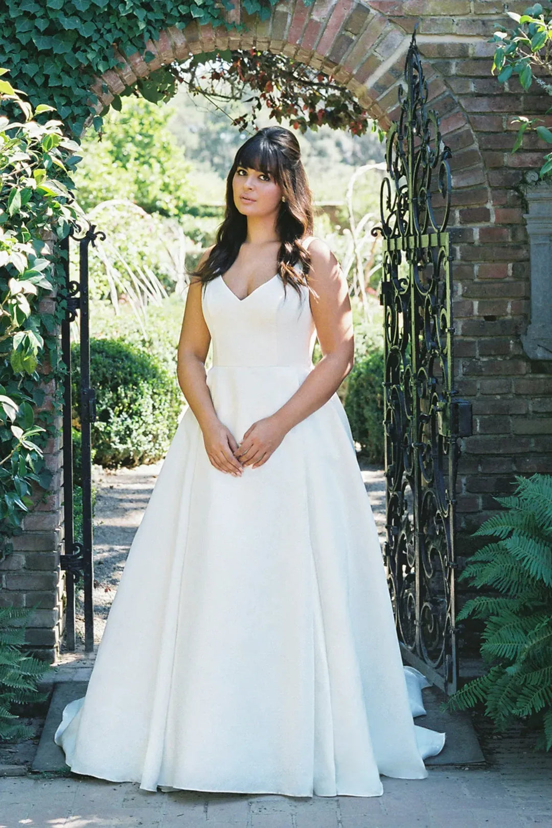full front of anne barge lucie ivory organza ball gown wedding dress with a v neckline and thick straps