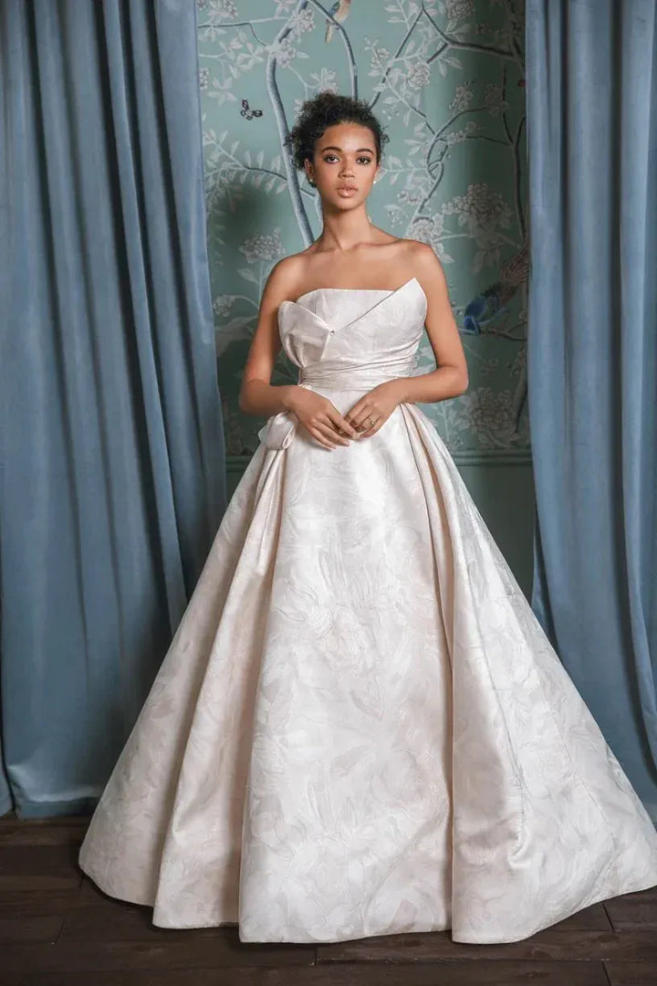 full front of anne barge montecito blush jacquard ball gown wedding dress showing the draping on the strapless bodice and full skirt
