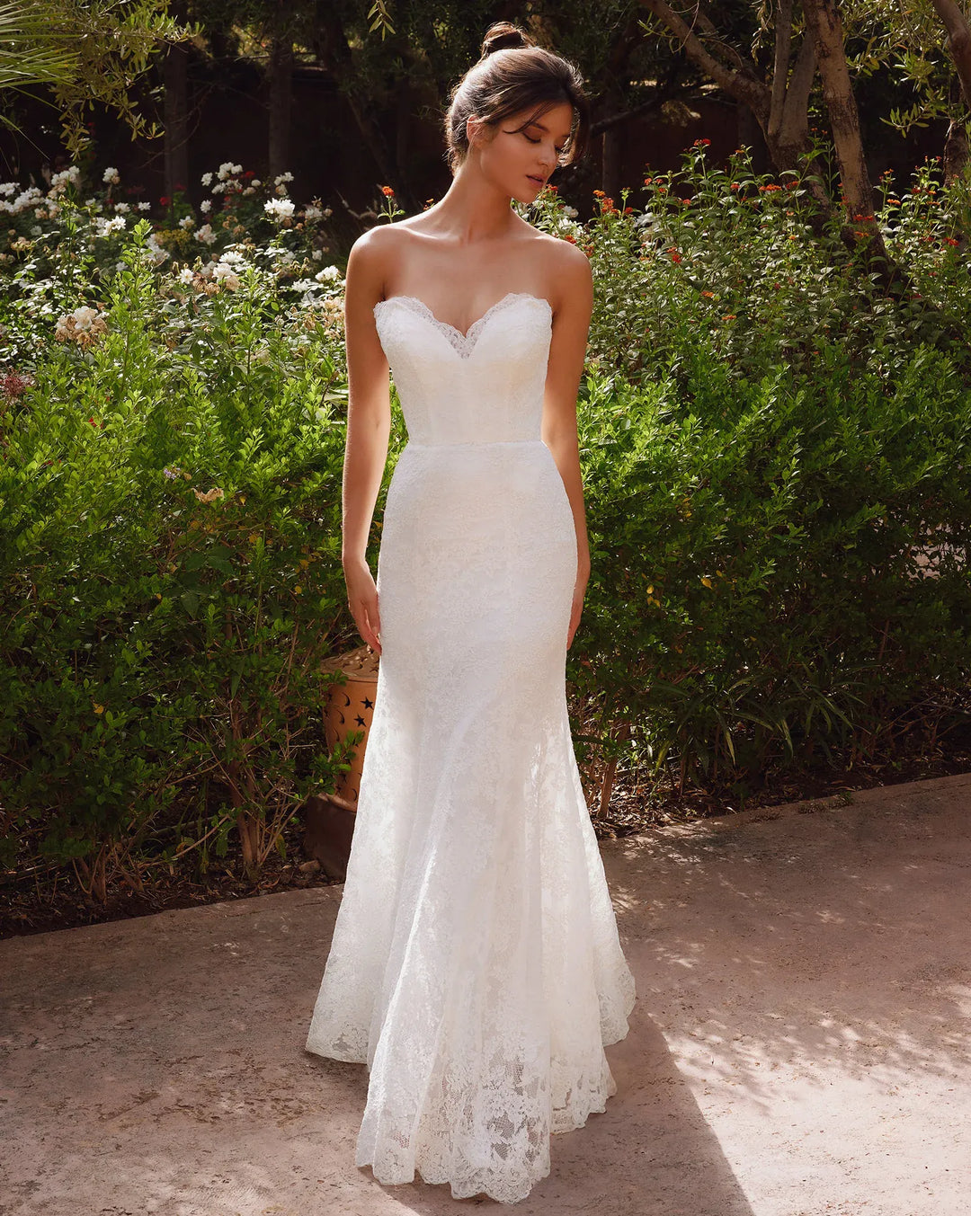 full front of antonio gual arren ivory lace fitted wedding dress with a strapless sweetheart neckline