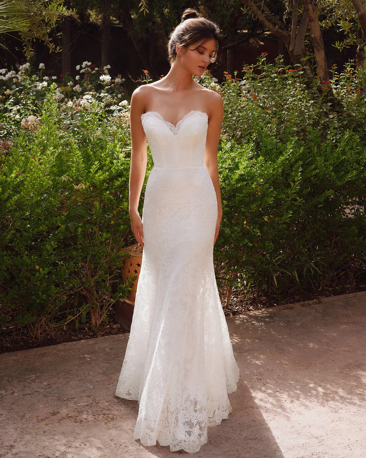 full front of antonio gual arren ivory lace fitted wedding dress with a strapless sweetheart neckline