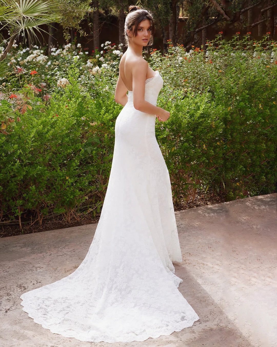 full back of antonio gual arren ivory lace fitted wedding dress with a strapless sweetheart neckline