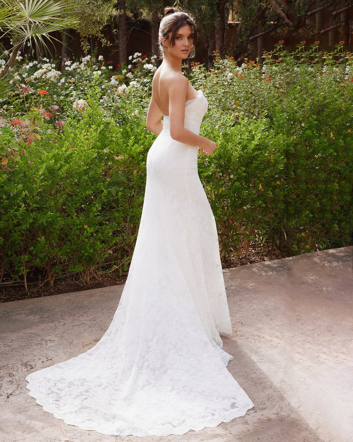 full back of antonio gual arren ivory lace fitted wedding dress with a strapless sweetheart neckline