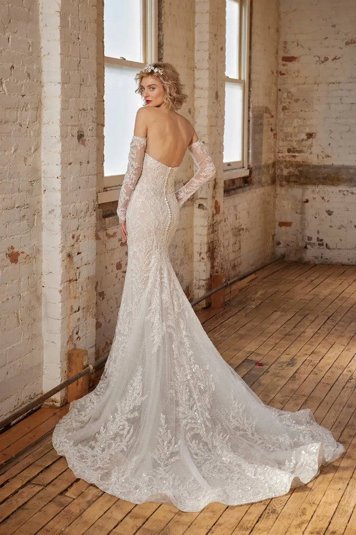 back of calla blanche artemis nude colored lace fitted wedding dress with a strapless sweetheart neckline. pictured with the matching sleeves, which are not included.