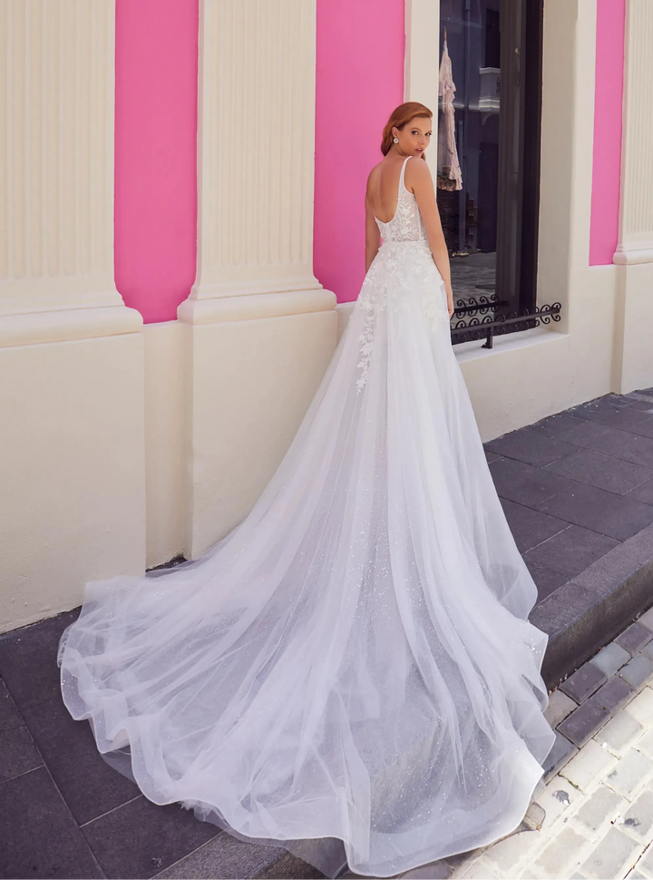 full back of calla blanche azucena ivory lace mini dress with a matching tulle overskirt