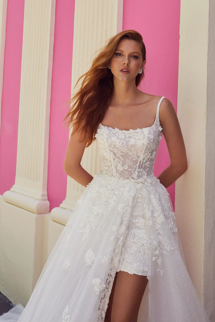 close up of calla blanche azucena ivory lace mini dress with a matching tulle overskirt