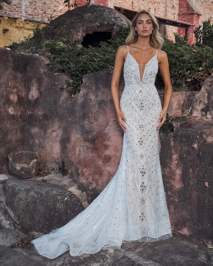 front of calla blanche gatsby ivory beaded sheath wedding dress with allover beading and a plunge neckline