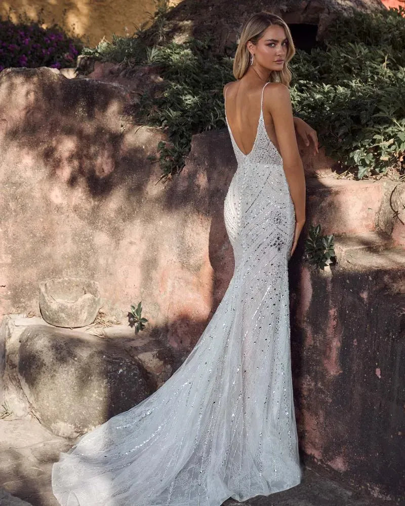 back of calla blanche gatsby ivory beaded sheath wedding dress with allover beading and an open back
