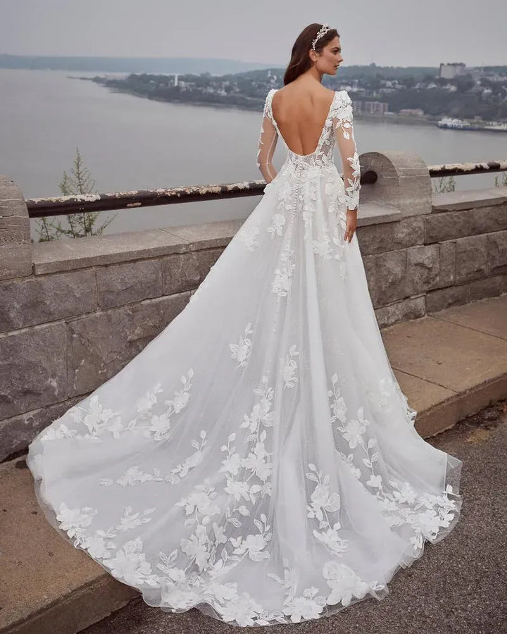 back of calla blanche leonora ivory tulle a-line wedding dress with an open back and chapel length train