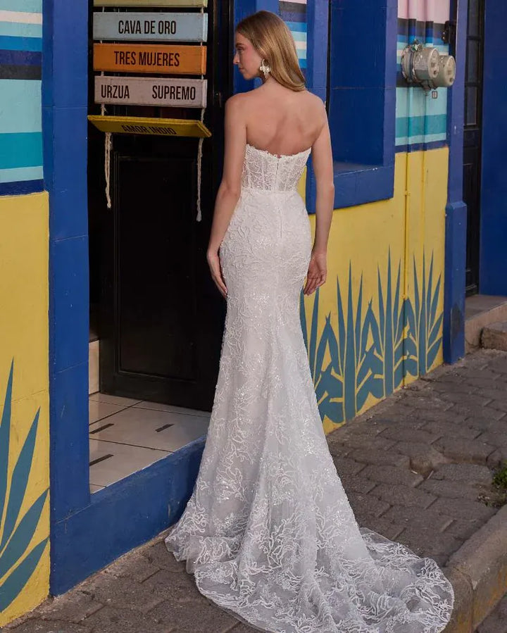 full back of calla blanche madeline ivory fitted lace wedding dress shown without the matching dimensional overskirt