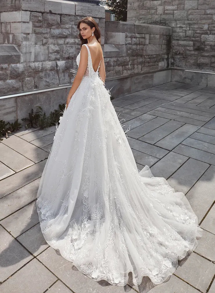 back of calla blanche mari ivory beaded lace ball gown wedding dress with an open back and long train