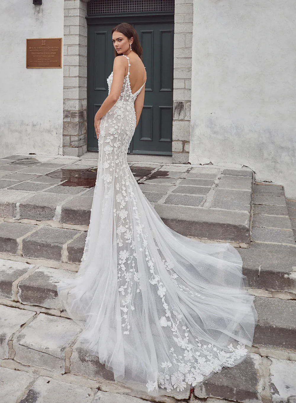 back of calla blanche meysara ivory and nude lace fitted wedding dress with an open back and lace detailed train