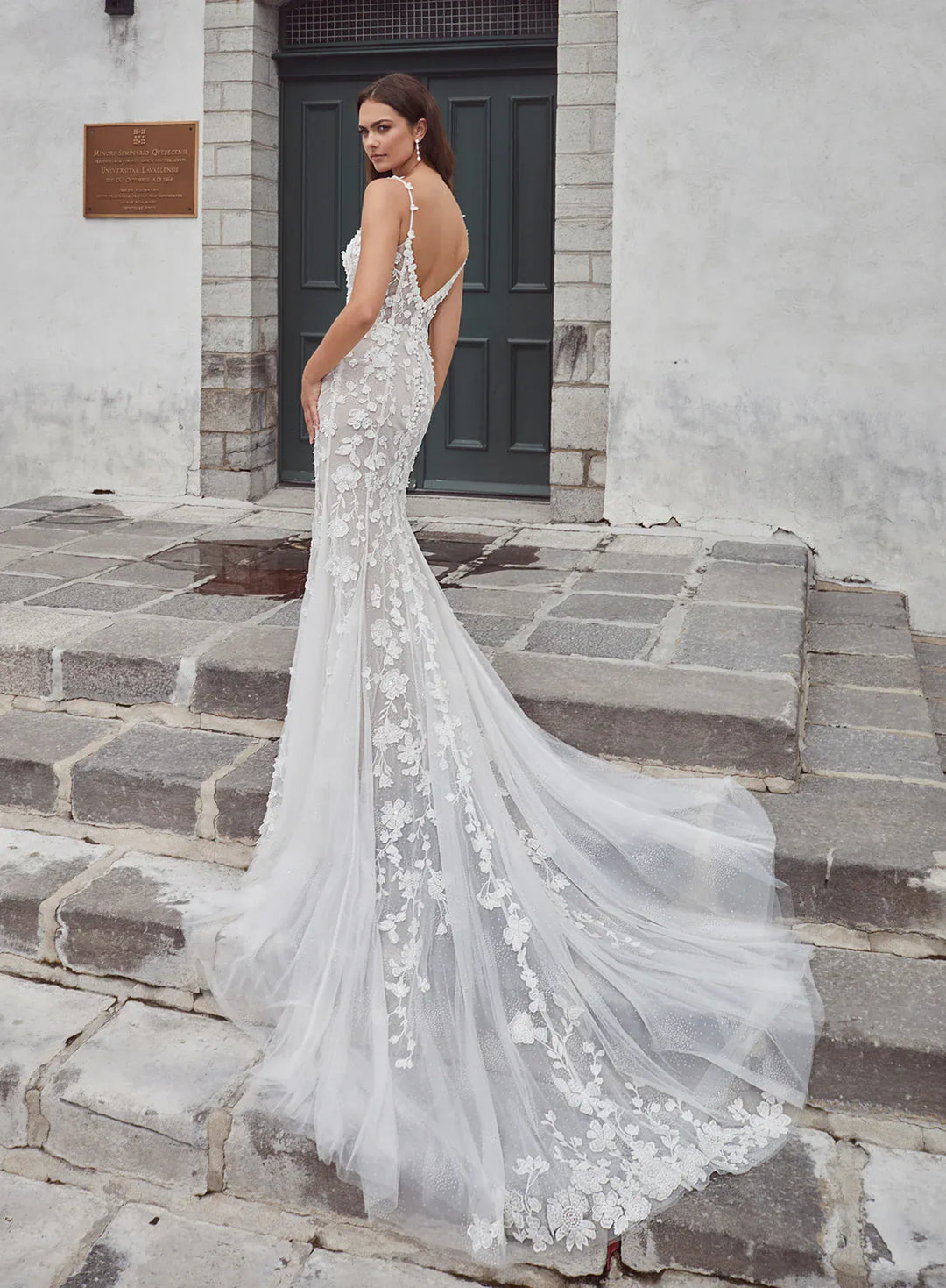 back of calla blanche meysara ivory and nude lace fitted wedding dress with an open back and lace detailed train