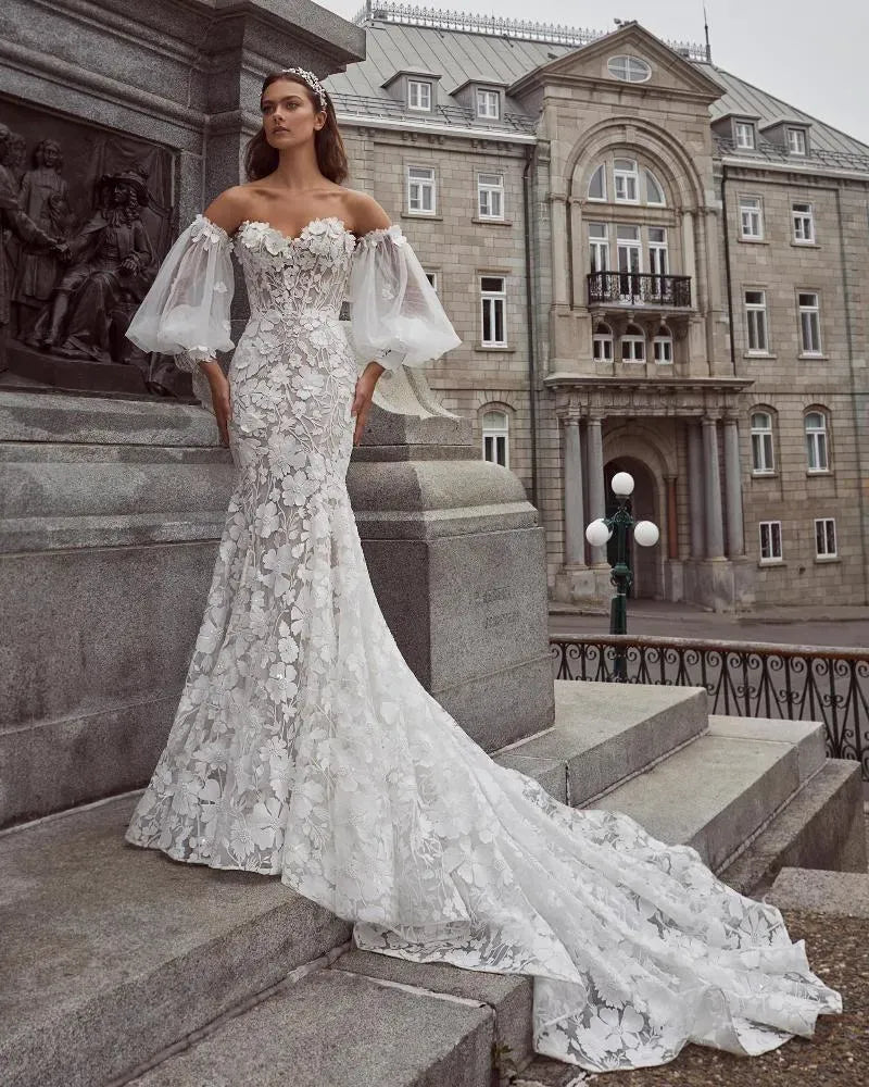 front of calla blanche nailah nude colord lace fit and flare wedding dress with a strapless sweetheart neckline, shown with the matching sleeves