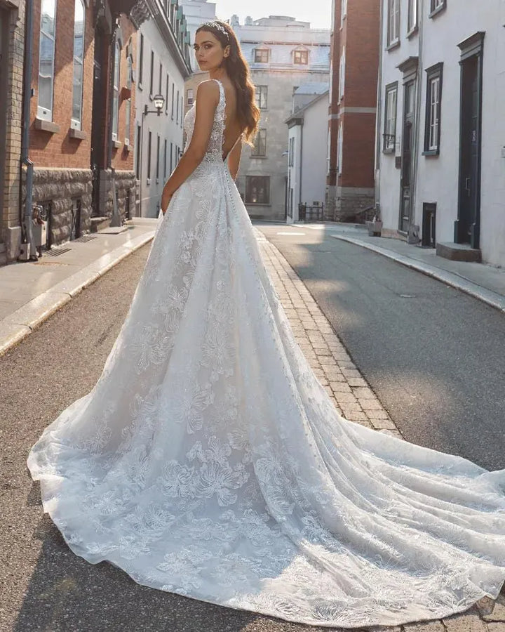 back of calla blanche roxy champagne tulle a-line wedding dress with allover lace and a long train
