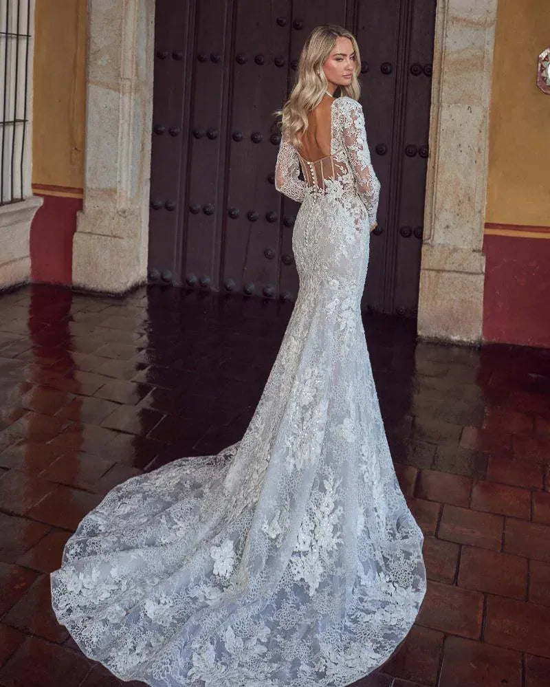 back of calla blanche sadee champagne lace fit and flare wedding dress with detachable long sleeves and a sheer back