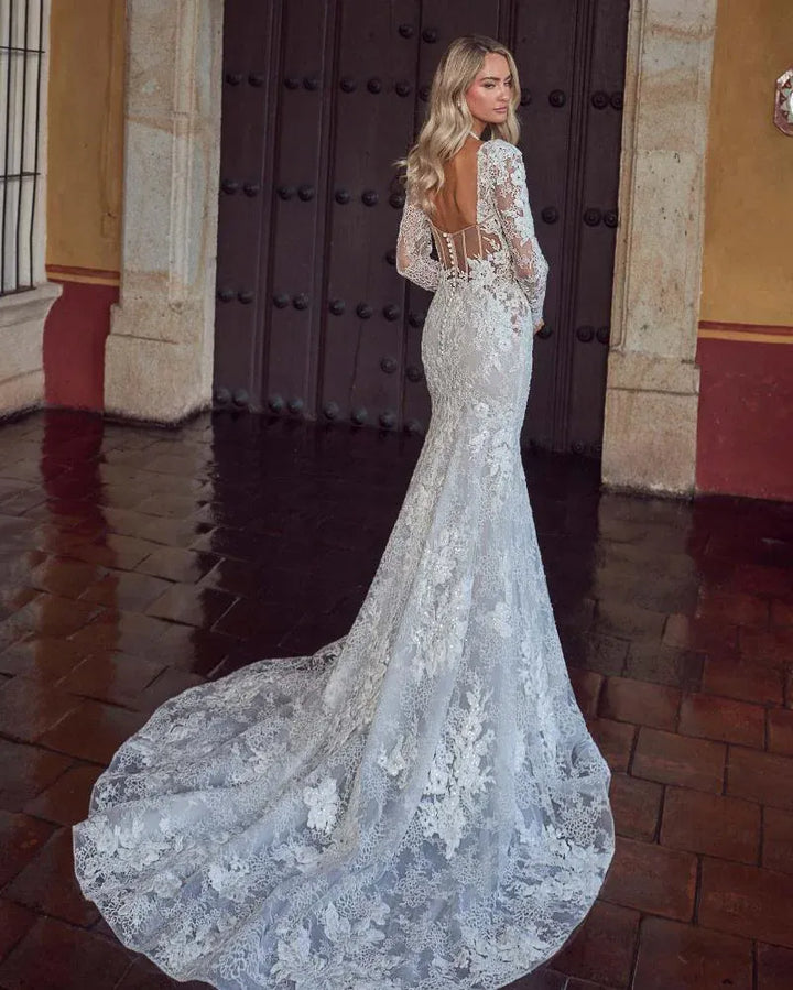 back of calla blanche sadee champagne lace fit and flare wedding dress with detachable long sleeves and a sheer back
