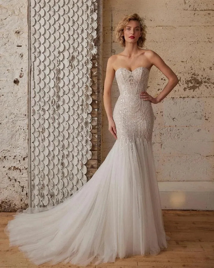 front of calla blanche wednesday champagne tulle fit and flare wedding dress with beaded bodice and strapless sweetheart neckline