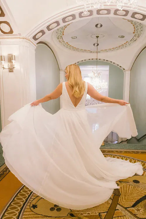 back of dany girl margery ivory lace fit and flare wedding dress with a tulle overlay and v back