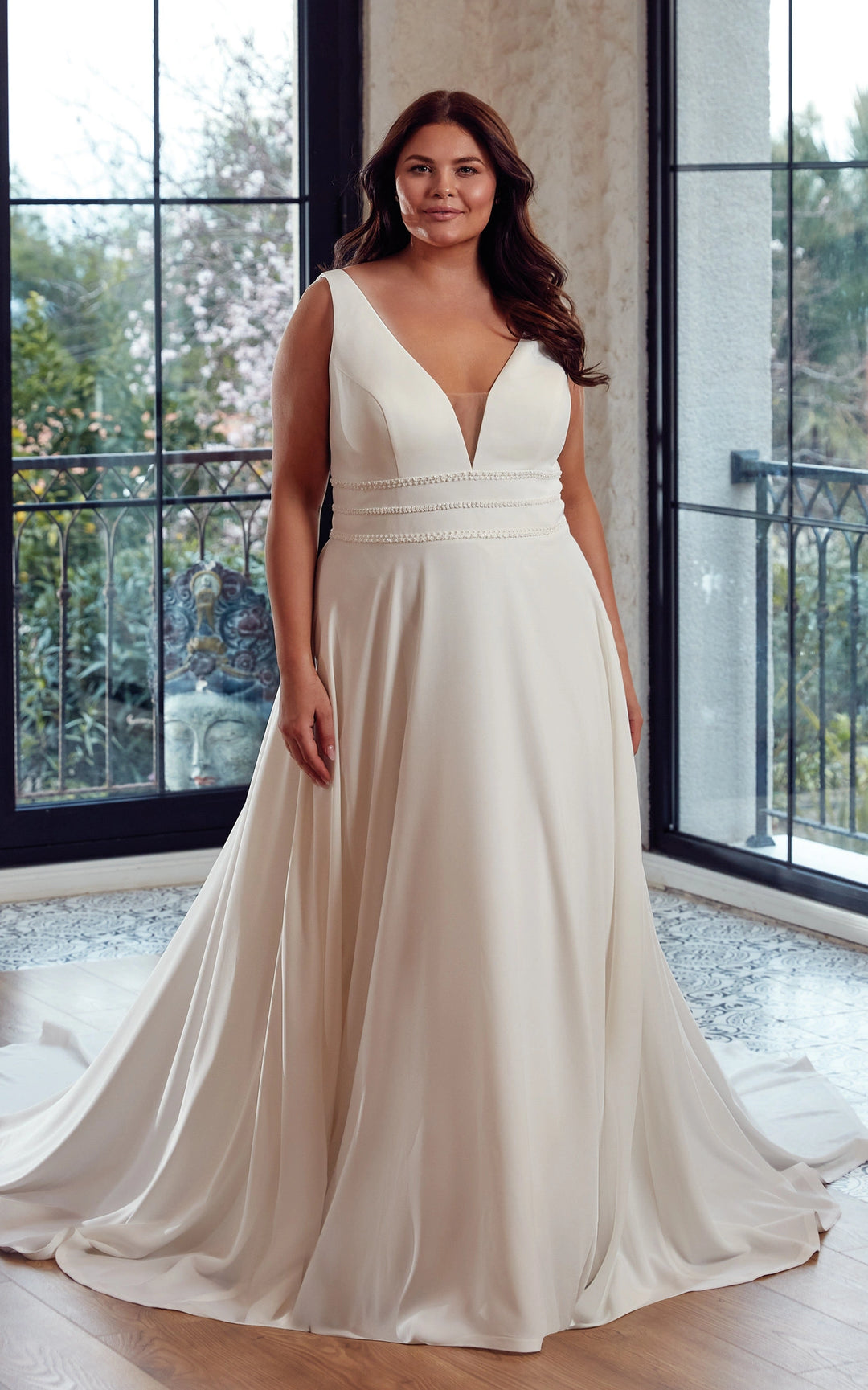 full front of eddy k addison ivory crepe a-line wedding dress with a v neckline and beaded accents at the waist