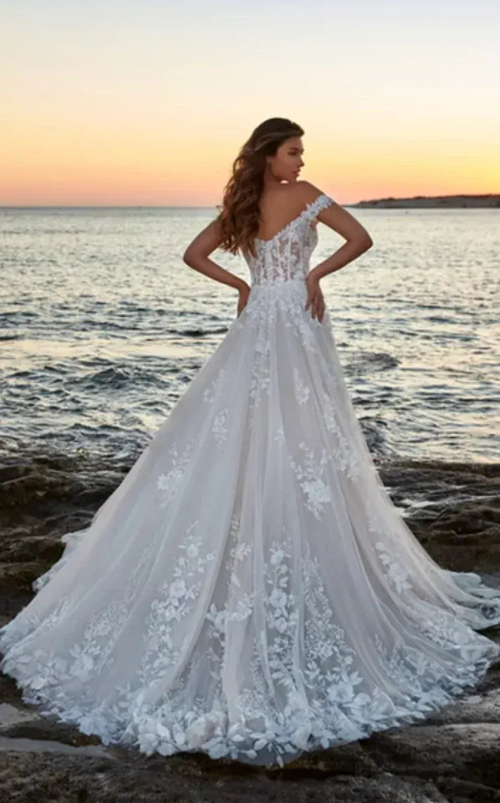 full back of eddy k dr2301 ivory tulle a-line wedding dress with scattered lace appliques and an off the shoulder neckline