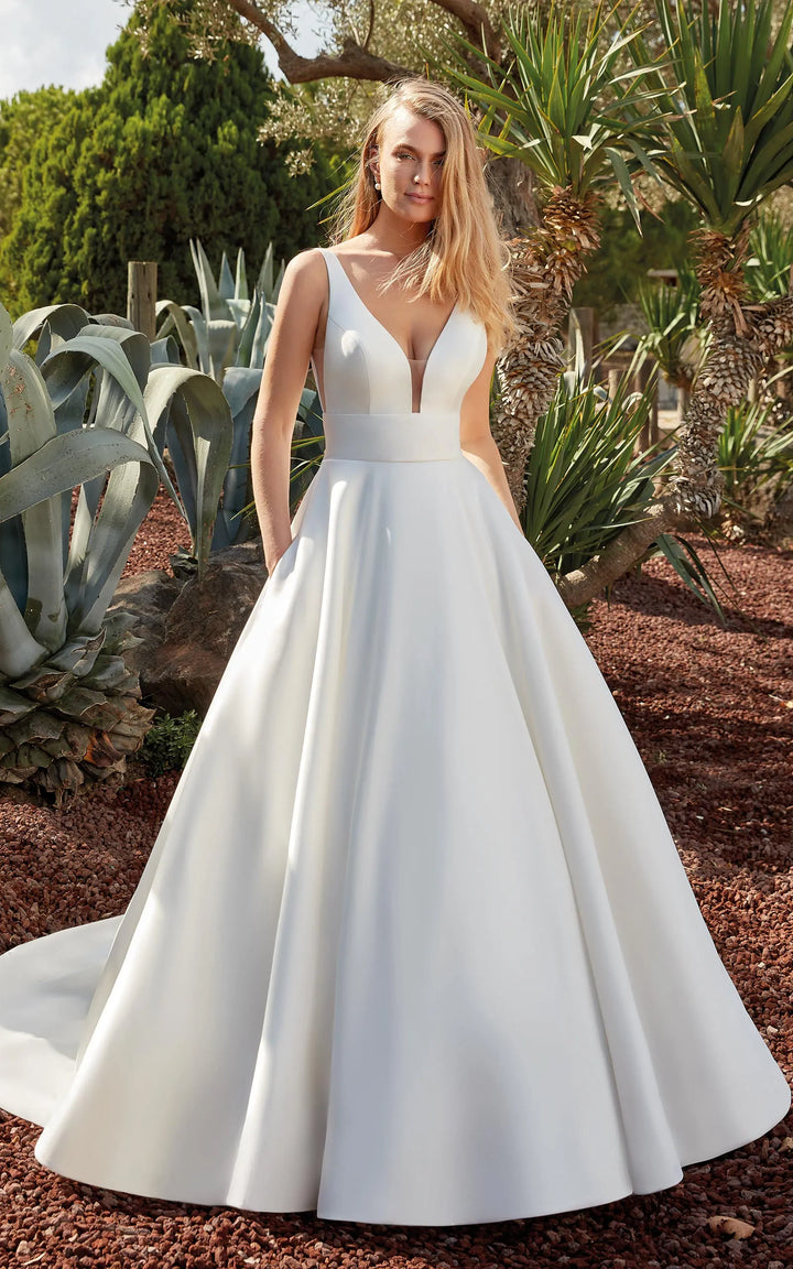 full front of eddy k becca ivory mikado ball gown wedding dress with a deep v neckline and chapel length train